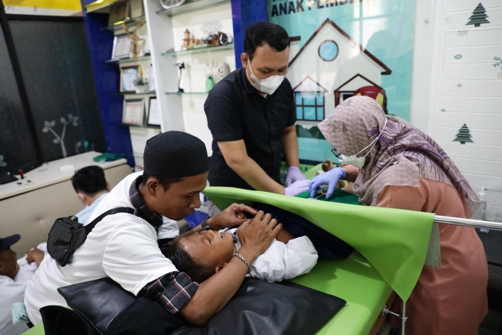 Transformasi Ekonomi Ojek Online: Sunat Massal, Program Sat Set, dan Harapan Perekonomian Stabil